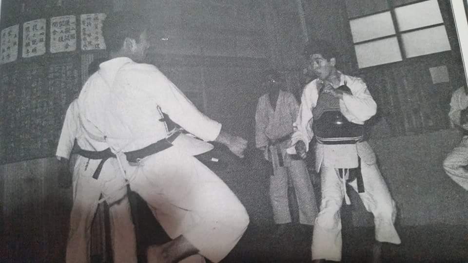 Tamon Kashimoto Sparring at the Hombu dojo with Kaiso Masayoshi Hisataka In The Background Watching